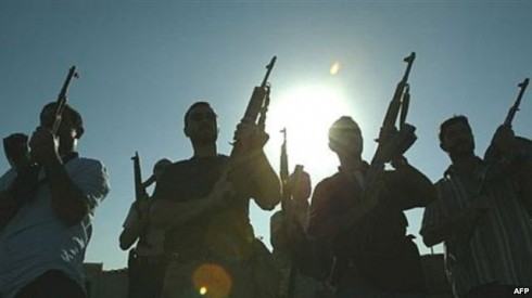 Members of a private security firm pose on the rooftop of a house in Baghdad - Iraq